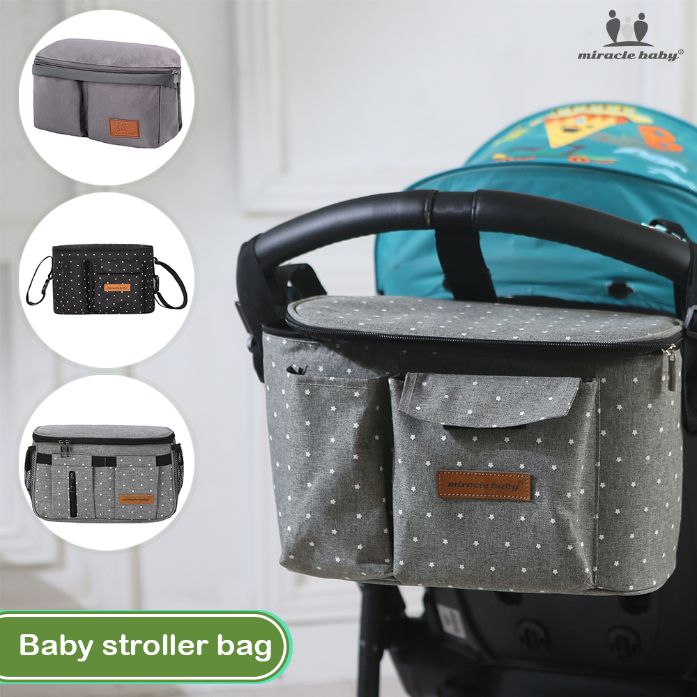 ผ้าอ้อมสำเร็จรูป แพมเพิสเด็กแรกเกิด Miracle Baby stroller hanging bag multi-functional Large Capacity storage mummy bag baby stroller outgoing portable car bag Children's stroller bag Shoulder Baby Diaper Bag Maternity Storage Bag Trav