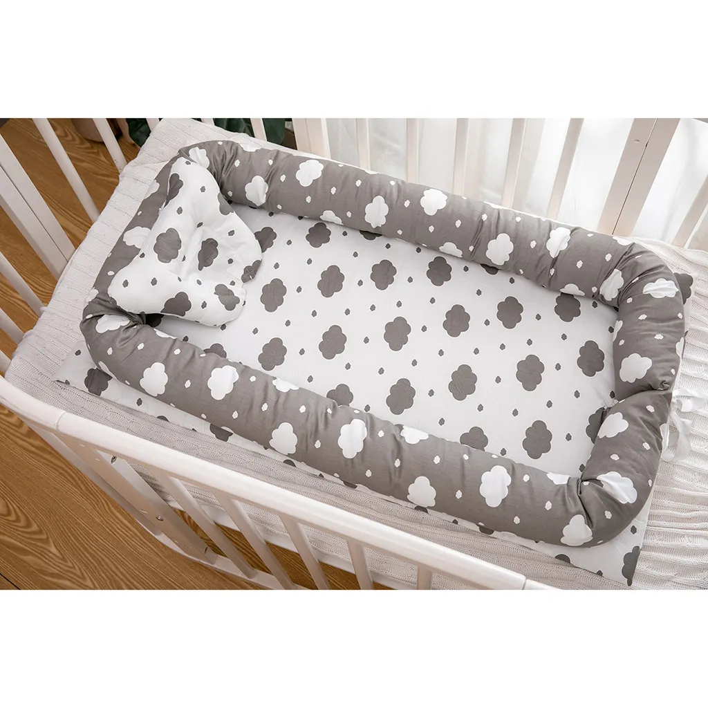 newborn sleeping on boppy lounger