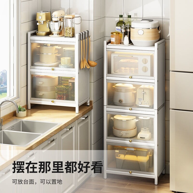 Gambar With the door of kitchen shelf floor cupboard household put pot dishes receive rack shelf in multilayer microwave oven